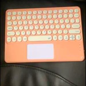 Pink blue tooth keyboard and mouse